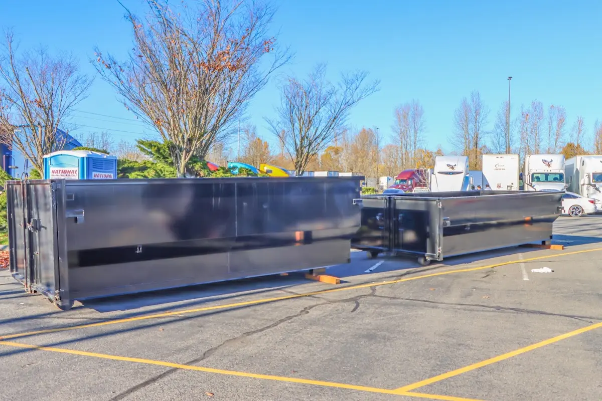 Professional dumpster rental service with roll-off container on residential driveway in Horizon West
